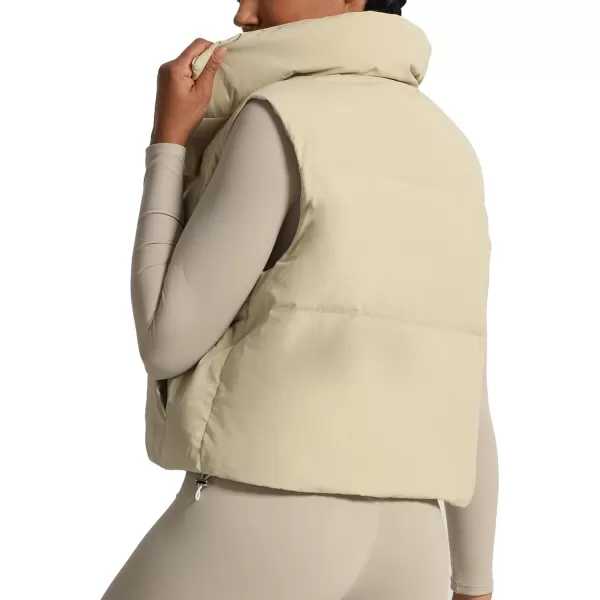 imageAoxjox Women Penelope Puffer Vest Lightweight Autumn Winter Outerwear Warm Stand Collar Cropped Down with PocketsIvory Nude