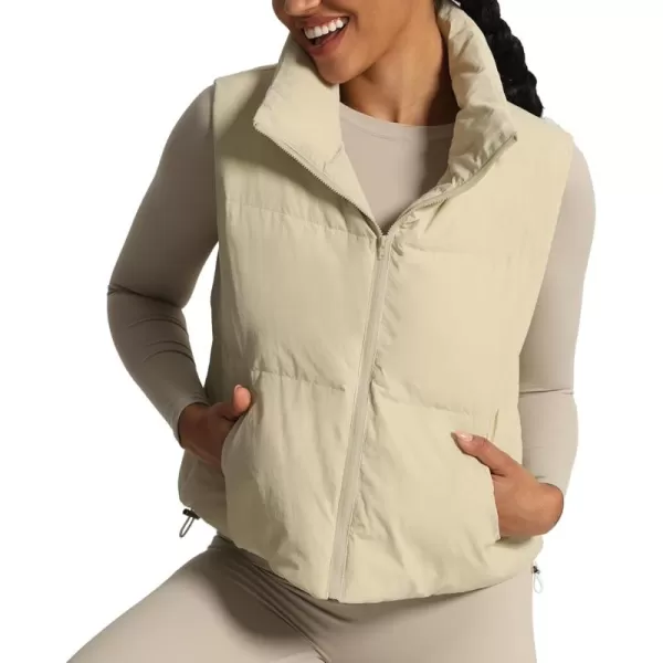 imageAoxjox Women Penelope Puffer Vest Lightweight Autumn Winter Outerwear Warm Stand Collar Cropped Down with PocketsIvory Nude