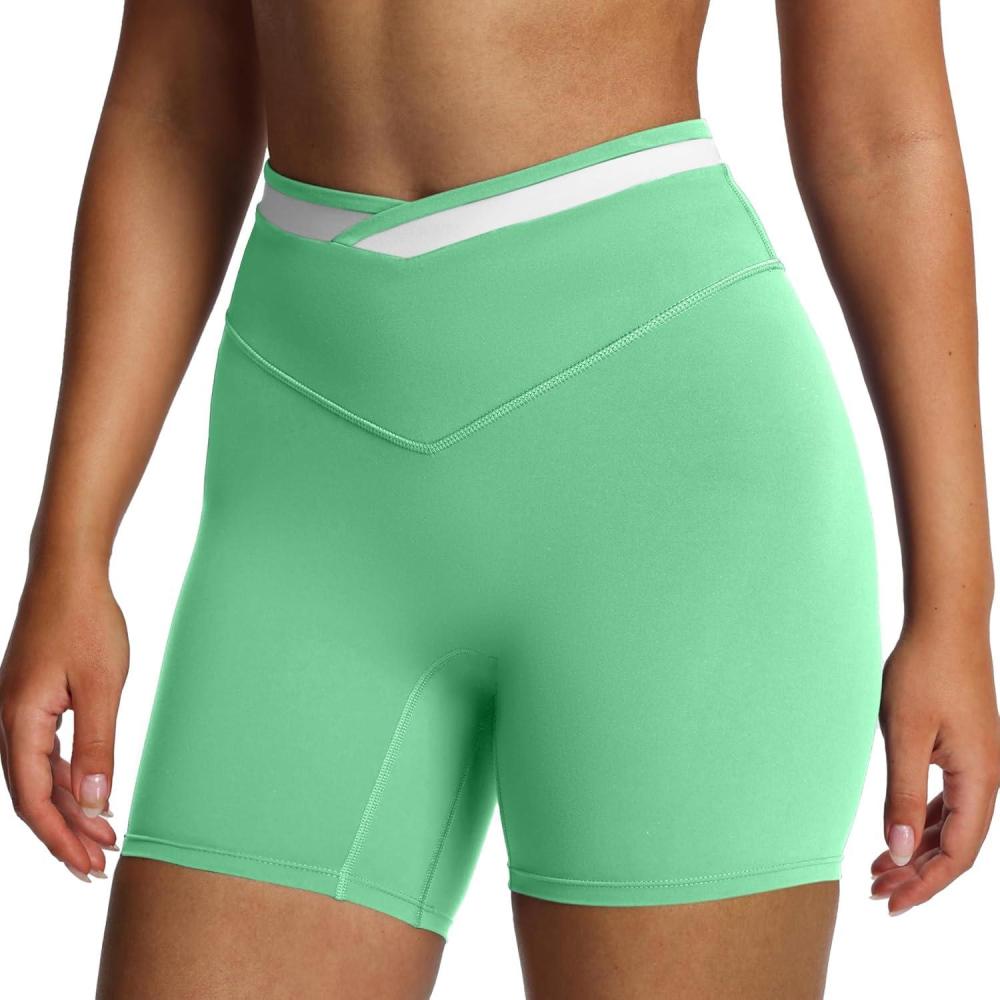 imageAoxjox Velma Workout Biker Shorts for Women Color Block CrossWaist High Waisted Exercise Gym Running Yoga Short 6quotKatydid GreenWhite