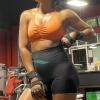 imageAoxjox Sports Bras for Women Workout Fitness Ruched Training Baddie Cross Back Yoga Crop TankOrange