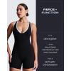 imageAoxjox Workout Rompers for Women Halter Cross Back One Piece Gym Yoga Sports Bras Lexi Lined Bodysuit ShortsBlack and White
