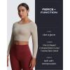 imageAoxjox Long Sleeve Crop Tops for Women Emma Twist Back Workout Cropped T Shirt TopMink