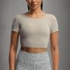 imageAoxjox Short Sleeve Crop Tops for Women Emma Backless Twist Back Workout Cropped T Shirt TopMink