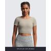imageAoxjox Short Sleeve Crop Tops for Women Emma Backless Twist Back Workout Cropped T Shirt TopMink