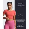 imageAoxjox Short Sleeve Crop Tops for Women Emma Backless Twist Back Workout Cropped T Shirt TopSpiced Coral