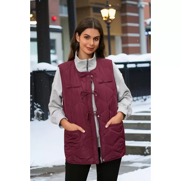imageECOWISH Women Puffer Vest Sleeveless Jacket Button Zip Up Winter Coat Quilted Padded Warm Gilet Outerwear with PocketsWine Red