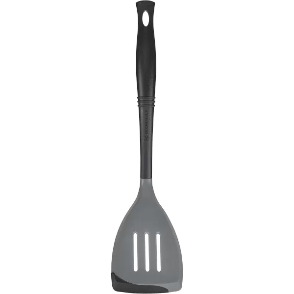 imageLe Creuset Revolution BiMaterial Slotted Turner 135quot x 25quot CeriseOyster