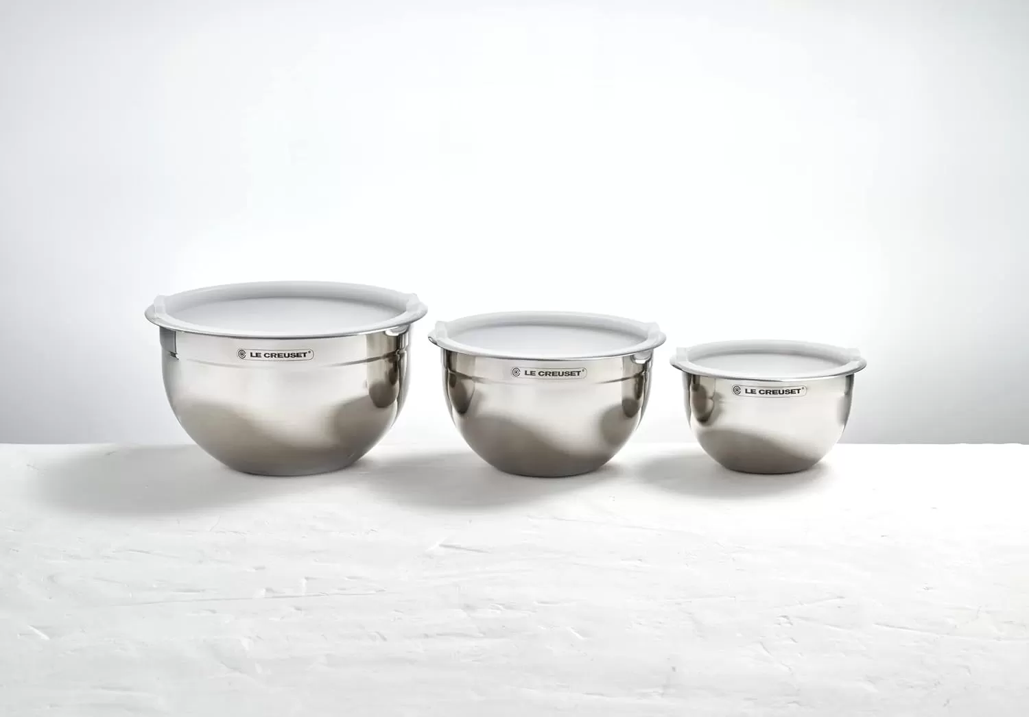 imageLe Creuset Set of 3 Nested Mixing Bowls wNonslip Silicone Base ampamp Plastic Air Tight Lids Large Stainless SteelMixing Bowls