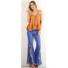 imageCHARTOU Womens Asymmetric Tassel Flared Slit Ripped Jeans Denim PantsBlue