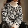 imageCHARTOU Women Fuzzy Leopard Knit Pullover Sweater Fall Winter Oversized Turtleneck Long Sleeve Jumper TopsWhite