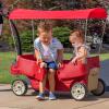 imageStep2 All Around Canopy Wagon Kids Ride On Toy Stroller Substitute Includes Seat Belts Made of Durable Plastic Max Weight 75 lbs For Toddlers 155 Years OldRed
